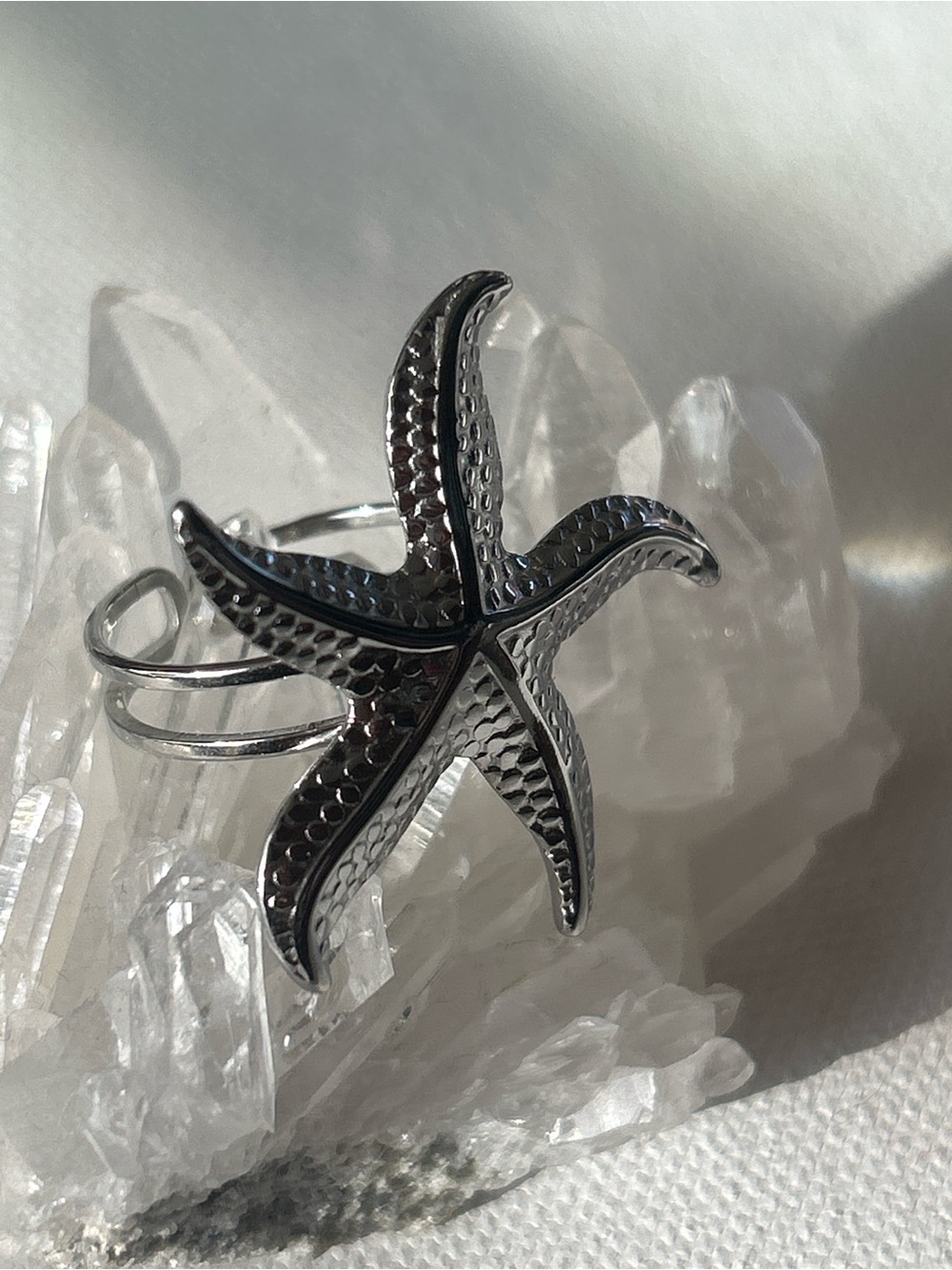 Silver stainless steel starfish ring with textured surface adjustable